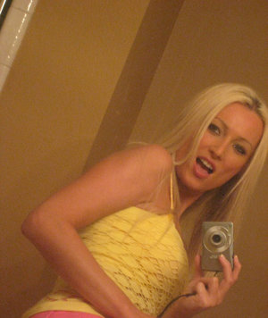 18 year old female Doris G slips off her underwear to pose naked on her bed